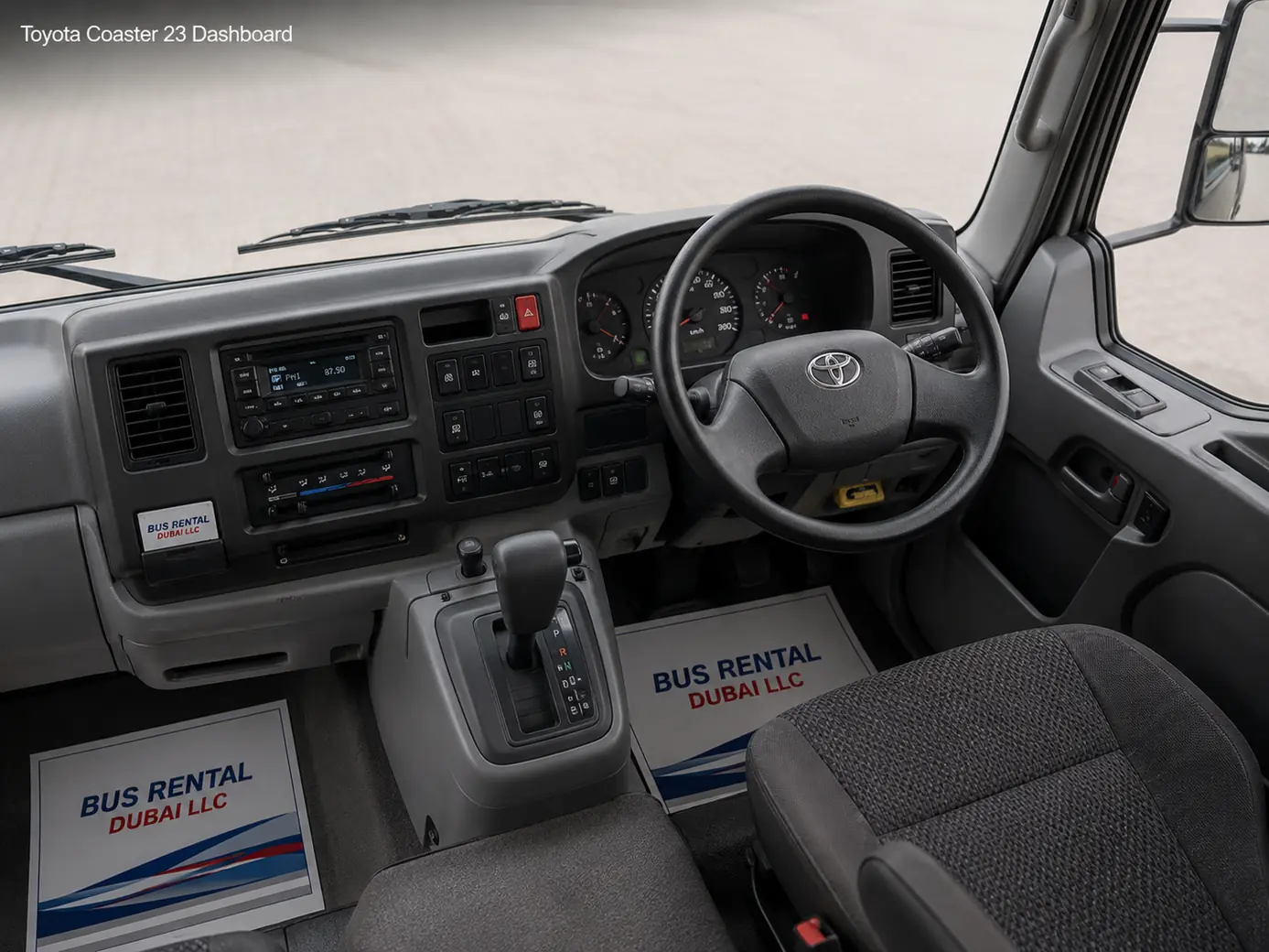 Toyota Coaster 23 Seater Mini Bus Rental Dubai — Dashboard Cockpit Image for Bus Rental Dubai